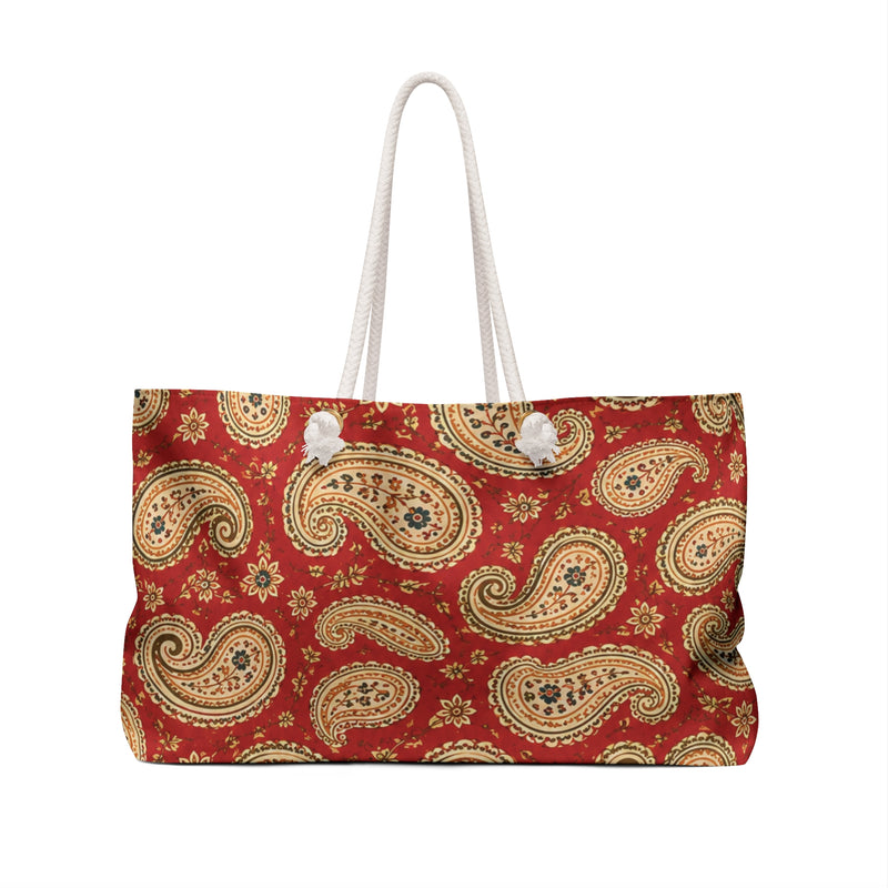 Paisley Monogram Weekender Bag carried on the shoulder with cream rope handles