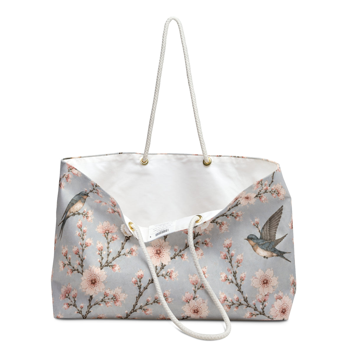 Close-up of the cherry blossom and swallow print detail on the Floral Bird Weekender Bag