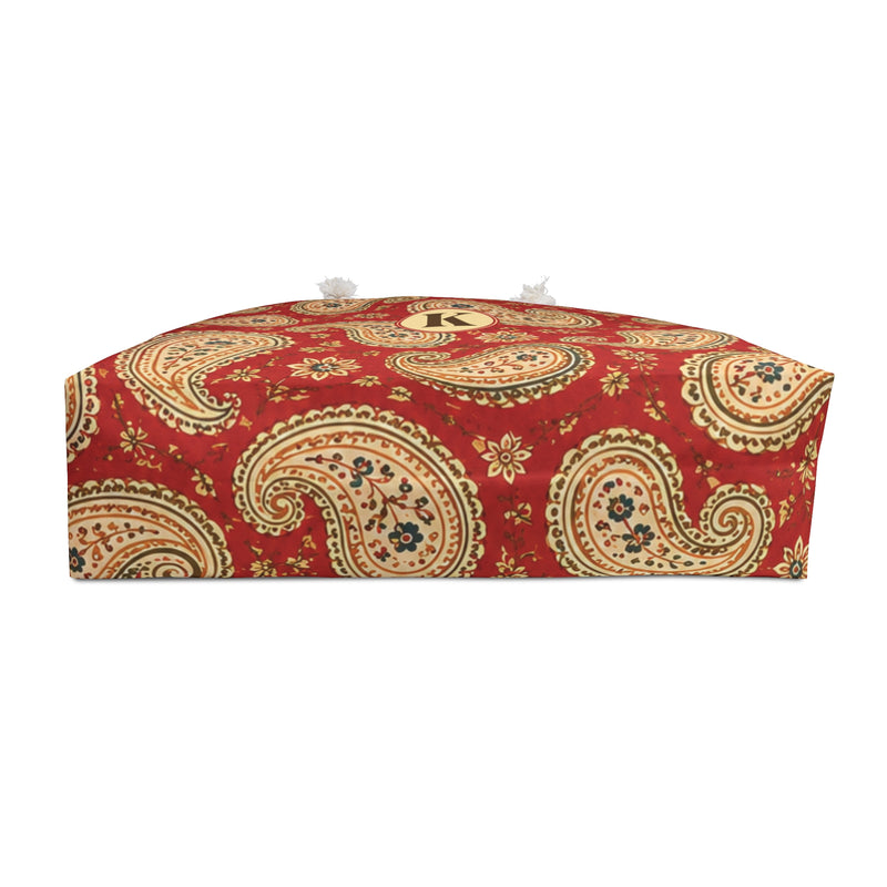 Paisley Monogram Weekender Bag shown flat, highlighting the structured T-bottom and cream lining