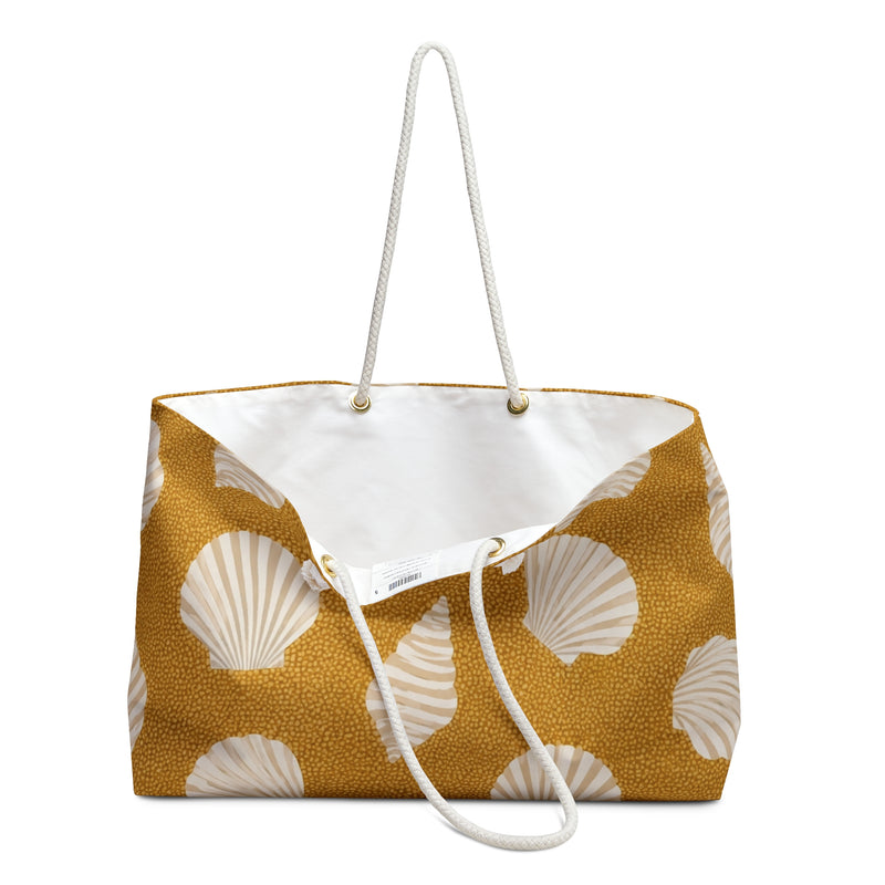 Seashell Sand Weekender Bag — close-up of the fabric print and hardware detail, cream shell motifs on golden-sand canvas