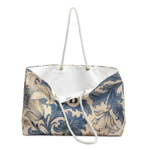 Monogrammed B Blue Floral Weekender Bag — close-up of the fabric print and hardware detail, blue and tan botanical floral print on cream canvas