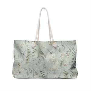 Botanical Fern Weekender Bag — angled view showing cream rope handles and gold-color grommets