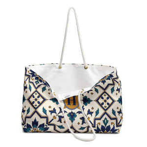 Monogram "H" Tile-Print Weekender Bag – close-up detail of the monogrammed "H" on the tile-inspired print