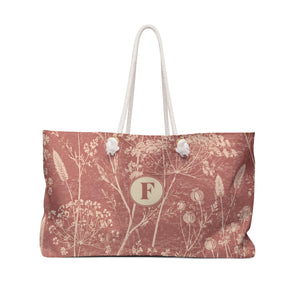 Floral Monogram "F" Weekender Bag – front view showing the faded wildflower print in muted terracotta tones