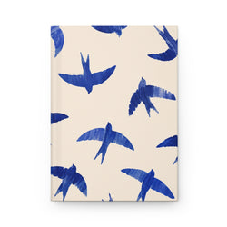 Blue Swallow Hardcover Journal, front cover, closed on a flat surface