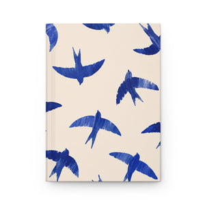 Blue Swallow Hardcover Journal, front cover, closed on a flat surface