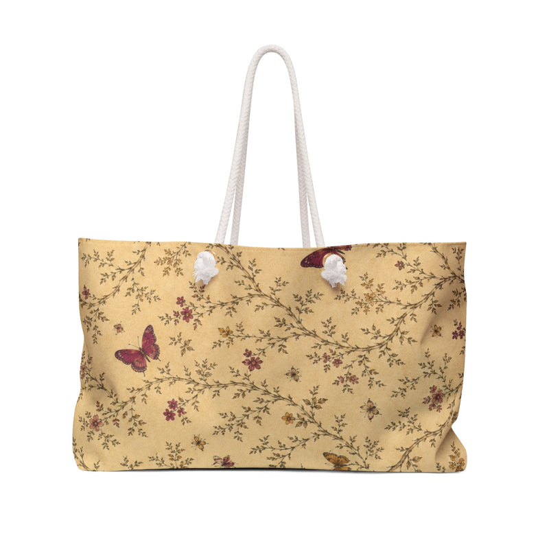 Butterfly Floral Weekender Bag — front view showing the butter-yellow canvas with floral sprigs and butterflies