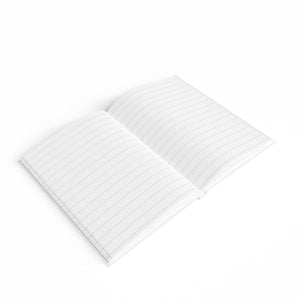 Floral Tile Ruled Journal shown next to a pen for scale, compact size