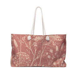 Botanical Dusty Rose Weekender Bag — front view showing the full exterior print, delicate wildflowers in a faded botanical sketch style on washed-rose exterior