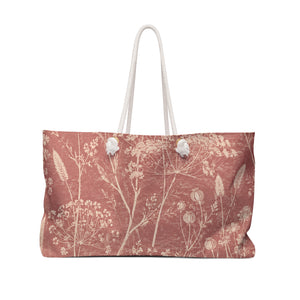 Botanical Dusty Rose Weekender Bag — front view showing the full exterior print, delicate wildflowers in a faded botanical sketch style on washed-rose exterior