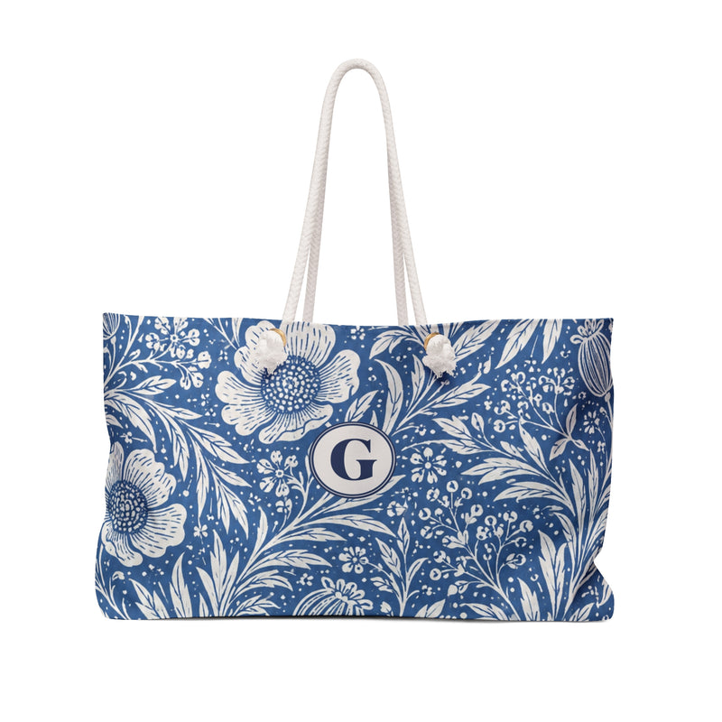 Blue Floral Monogram "G" Weekender Bag – front view showing the blue-and-cream watercolor floral print