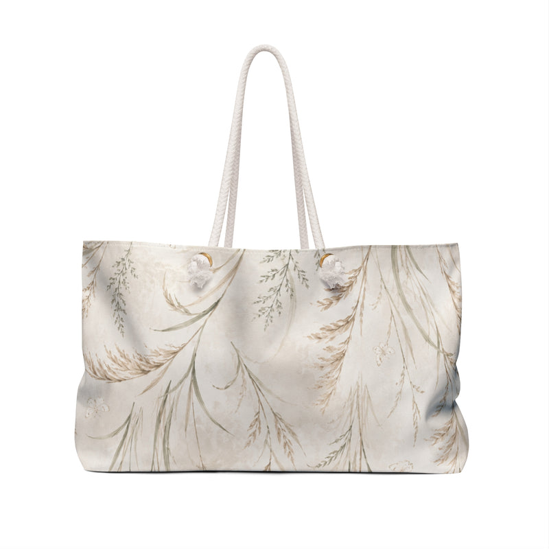 Botanical Weekender Bag — angled view showing cream rope handles and gold-tone grommets