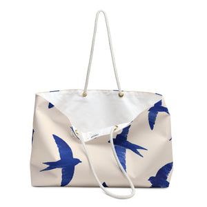 Close-up of the cobalt swallow print detail on the Blue Swallow Print Weekender Bag