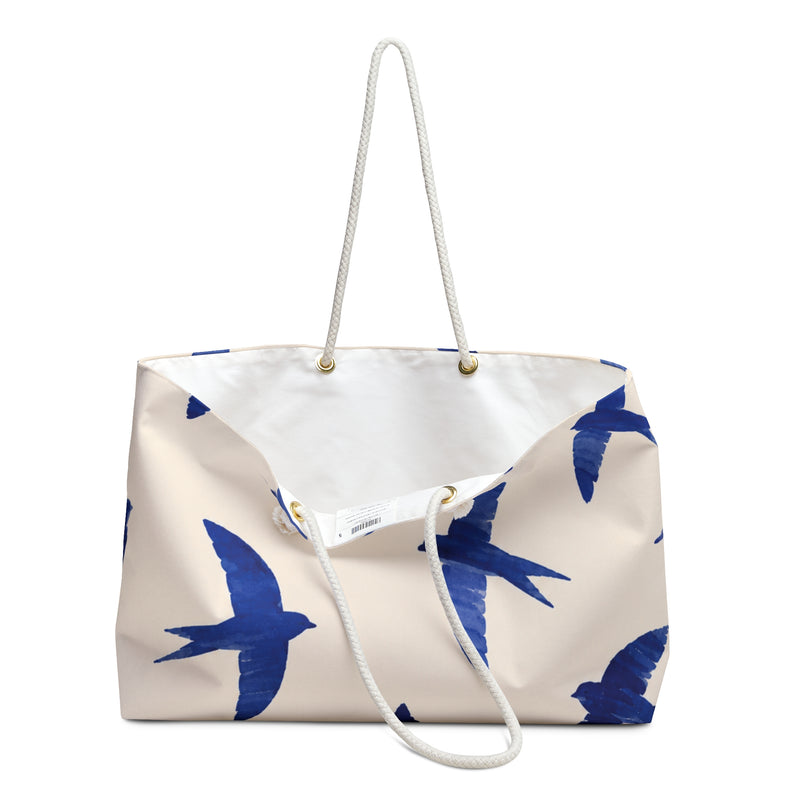 Close-up of the cobalt swallow print detail on the Blue Swallow Print Weekender Bag