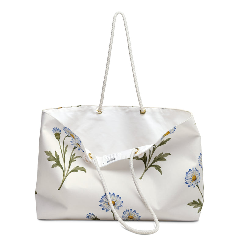Daisy Floral Weekender Bag — close-up of the fabric print and hardware detail, watercolor daisy print in light blue on cream