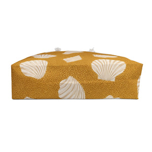 Seashell Sand Weekender Bag — interior lining view with the bag partially open, cream shell motifs on golden-sand canvas
