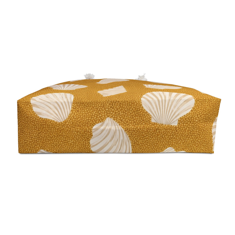 Seashell Sand Weekender Bag — interior lining view with the bag partially open, cream shell motifs on golden-sand canvas