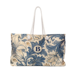 Monogrammed B Blue Floral Weekender Bag — front view showing the full exterior print, blue and tan botanical floral print on cream canvas