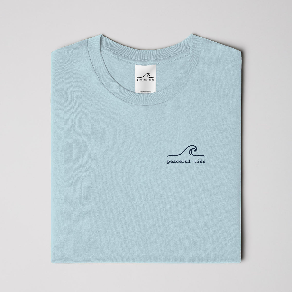 Rest Is Still Progress Tee in chambray — on model, side view