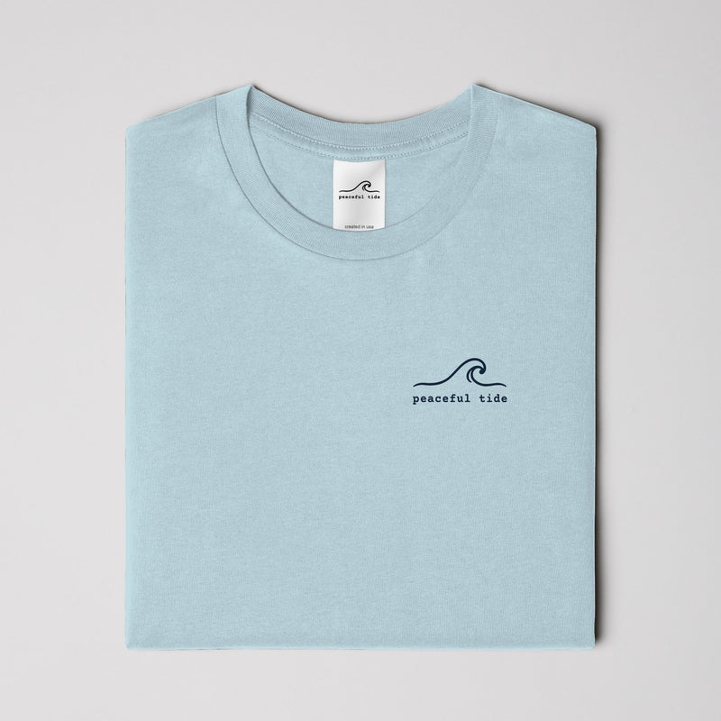 Rest Is Still Progress Tee in chambray — on model, side view
