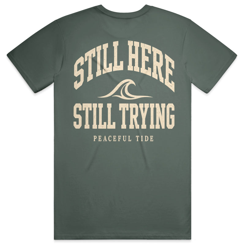 Still Here Still Trying Mental Health Awareness Tee in Blue Spruce — Back, worn on model