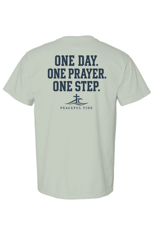 One Day, One Prayer, One Step Tee in Bay — Back, worn on model
