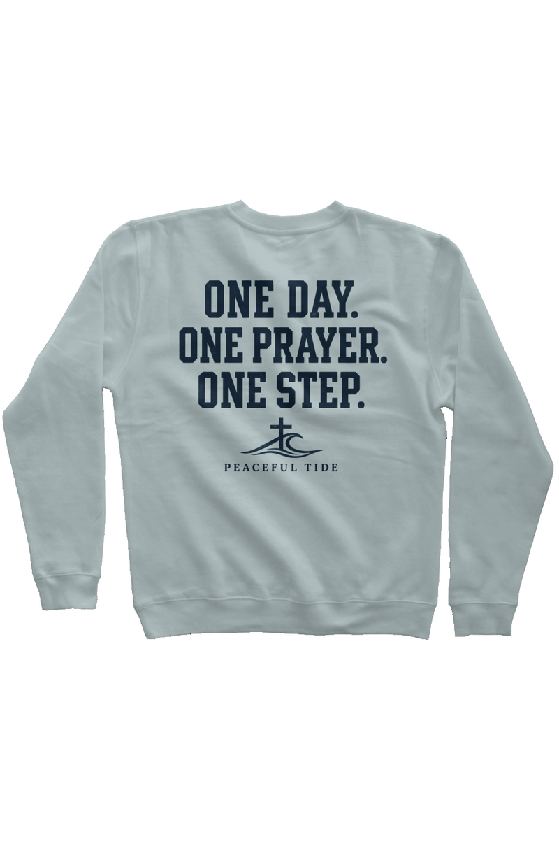 One Day, One Step, One Prayer Sweatshirt in Pigment Sage, worn by a model, back view