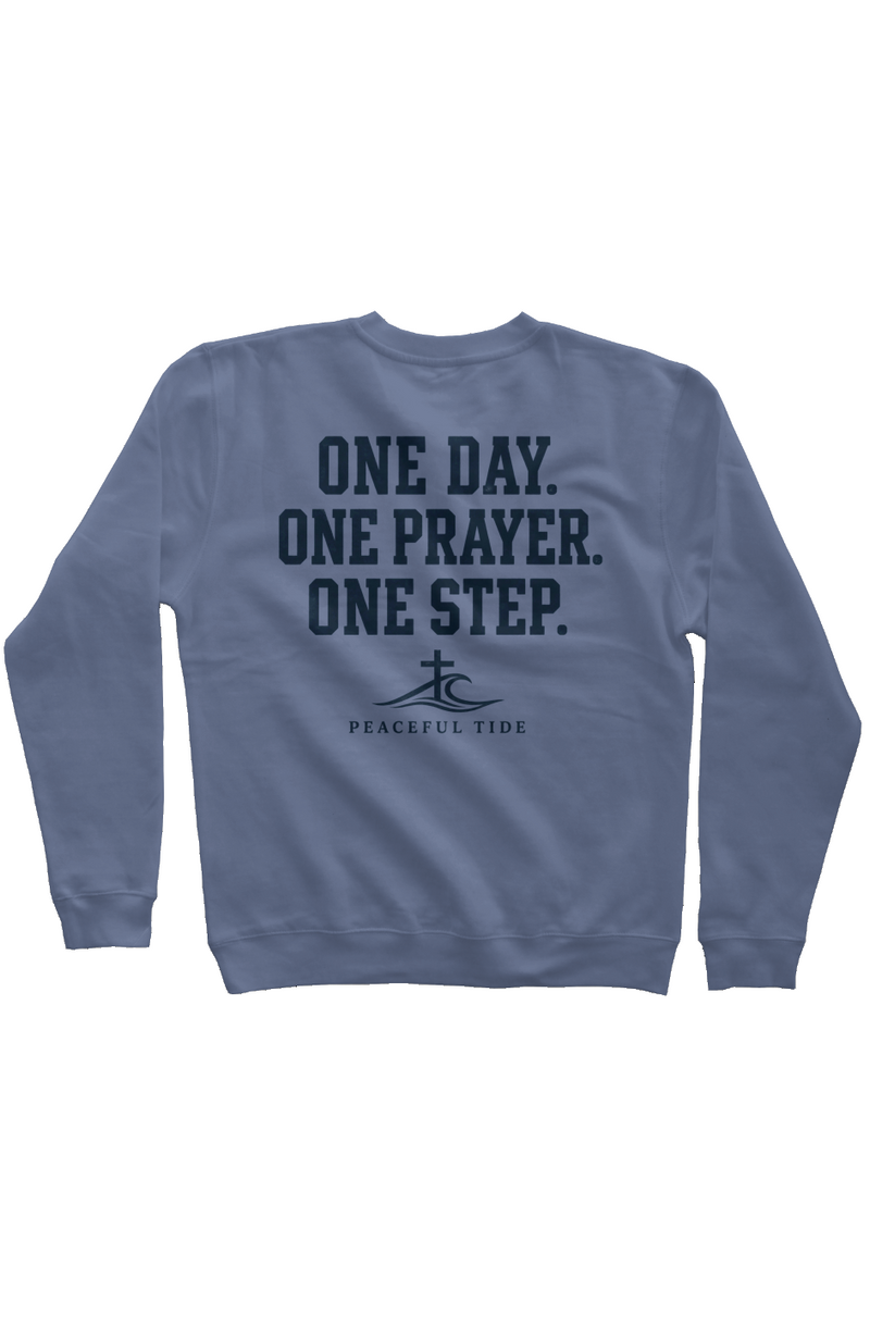 One Day, One Step, One Prayer Sweatshirt in Pigment Slate Blue, worn by a model, front view