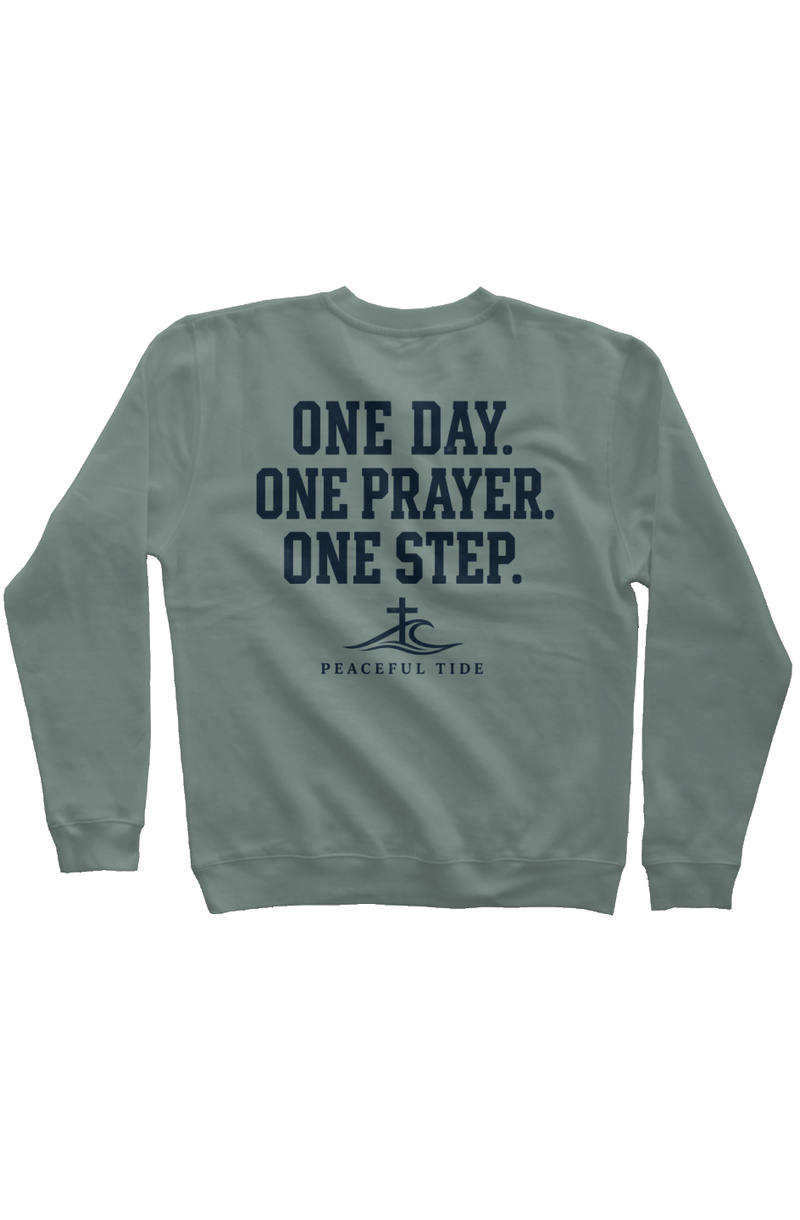 One Day, One Step, One Prayer Sweatshirt in Pigment Alpine Green, worn by a model, back view