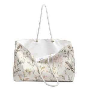 Close-up of the watercolor floral and songbird print detail on the Floral Bird Weekender Bag