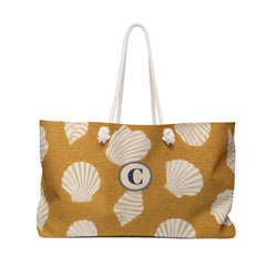 Shell Pattern Weekender Bag — front view showing the full exterior print, scattered scallop shell print on golden sand