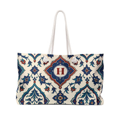 Monogrammed "H" Azulejo Weekender Bag – front view showing the indigo, teal, and rust azulejo tile print