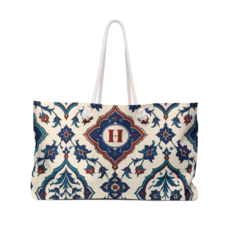 Monogrammed "H" Azulejo Weekender Bag – front view showing the indigo, teal, and rust azulejo tile print