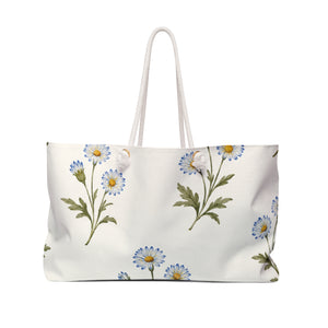 Daisy Floral Weekender Bag — front view showing the full exterior print, watercolor daisy print in light blue on cream