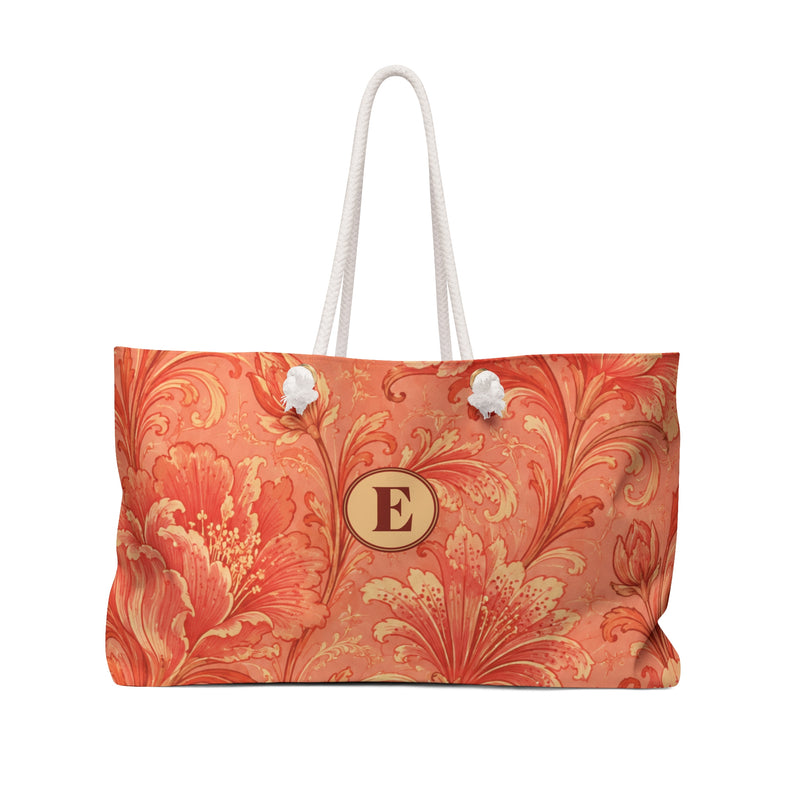 Coral Floral Monogram E Weekender Bag — front view showing the full exterior print, painterly coral-and-terracotta floral pattern
