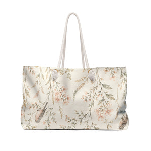 Floral Bird Weekender Bag carried on the shoulder with rope handles