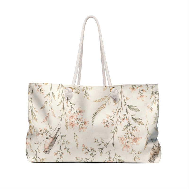 Floral Bird Weekender Bag carried on the shoulder with rope handles