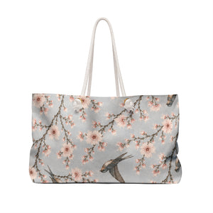 Cherry Blossom & Swallow Monogram Weekender Bag carried on the shoulder with rope handles