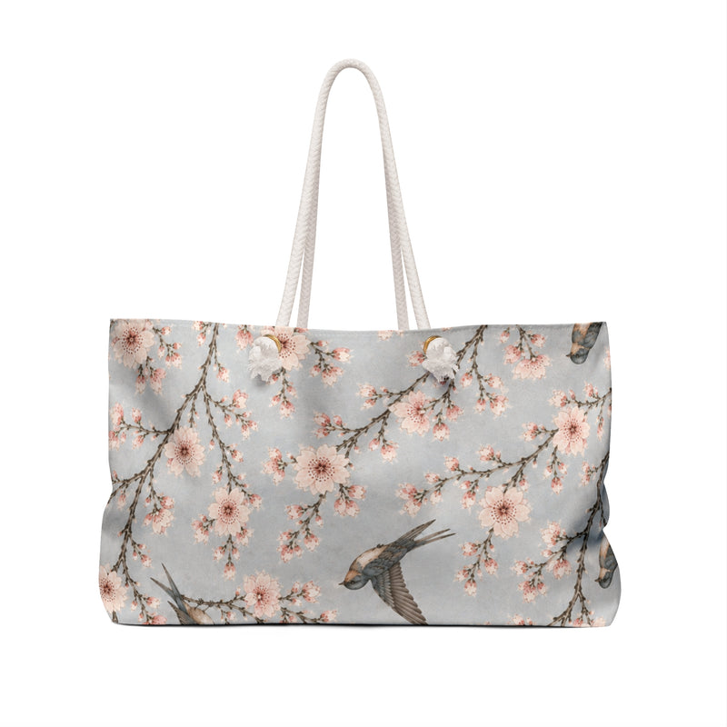 Cherry Blossom & Swallow Monogram Weekender Bag carried on the shoulder with rope handles