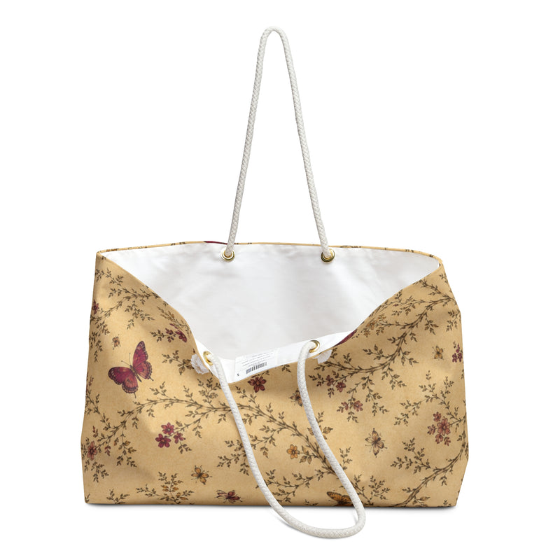 Close-up of the floral and butterfly print detail on the Butterfly Floral Weekender Bag