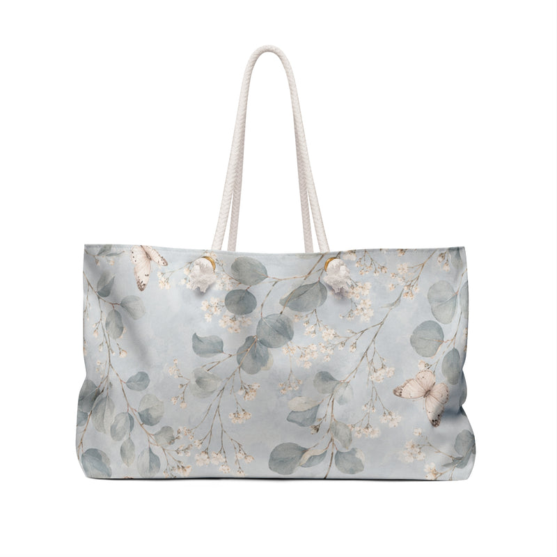 Floral Eucalyptus Weekender Bag — angled view showing cream rope handles and gold-color grommets
